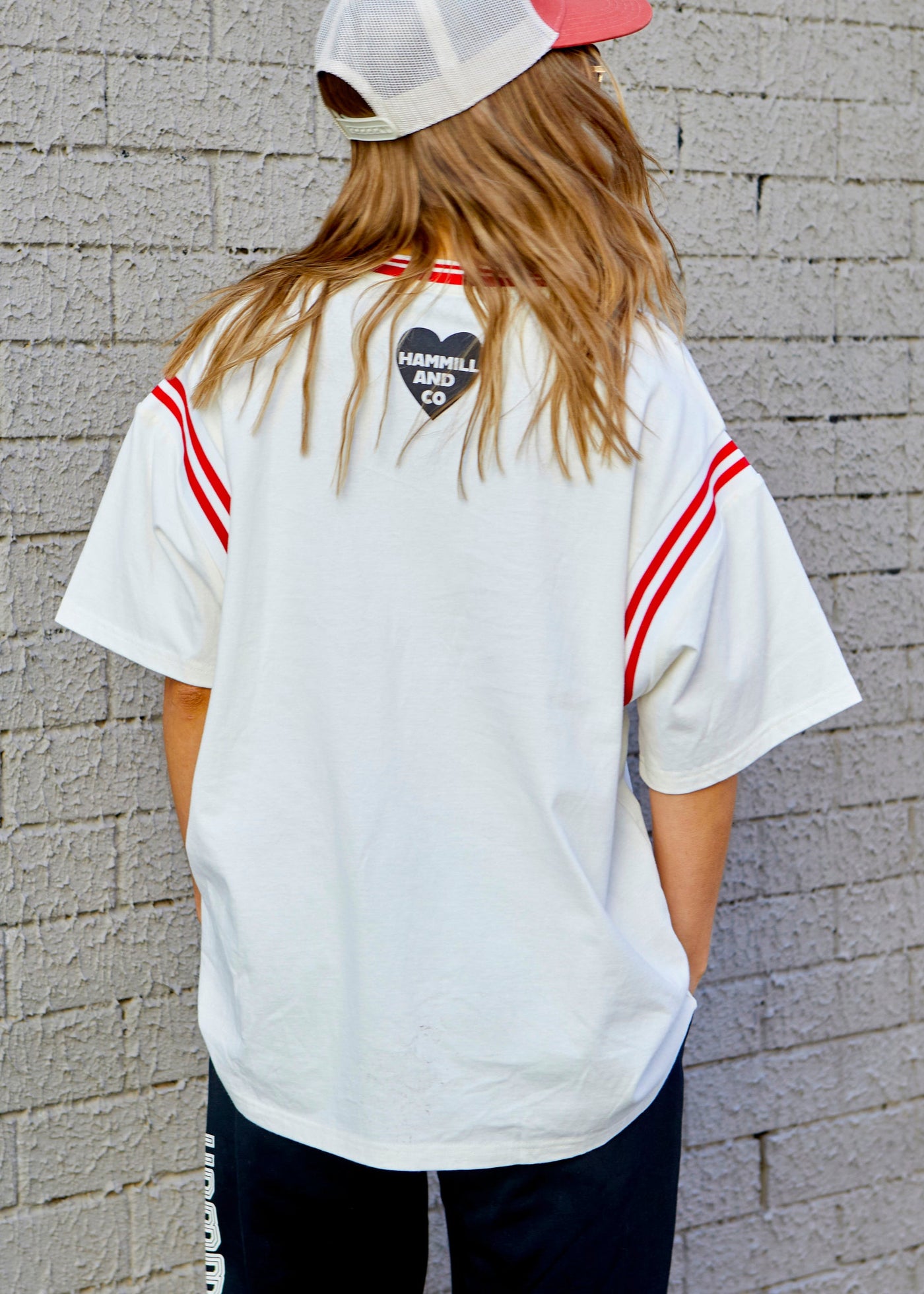 Hammill & Co tee with Rib panels on the sleeves and around the neck, peach cotton, La Vibe felt print on the front and small heart print on the back neck.