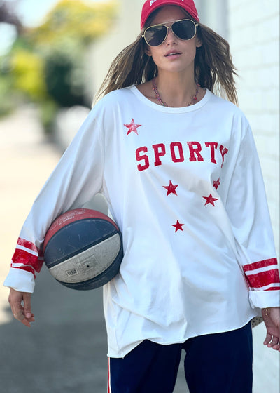 Hammill & Co oversized shape tee is here with raw hem.  Longer body and sleeves for a comfy look with leggings, distressed red sporty print on the front and stripes on each sleeve.