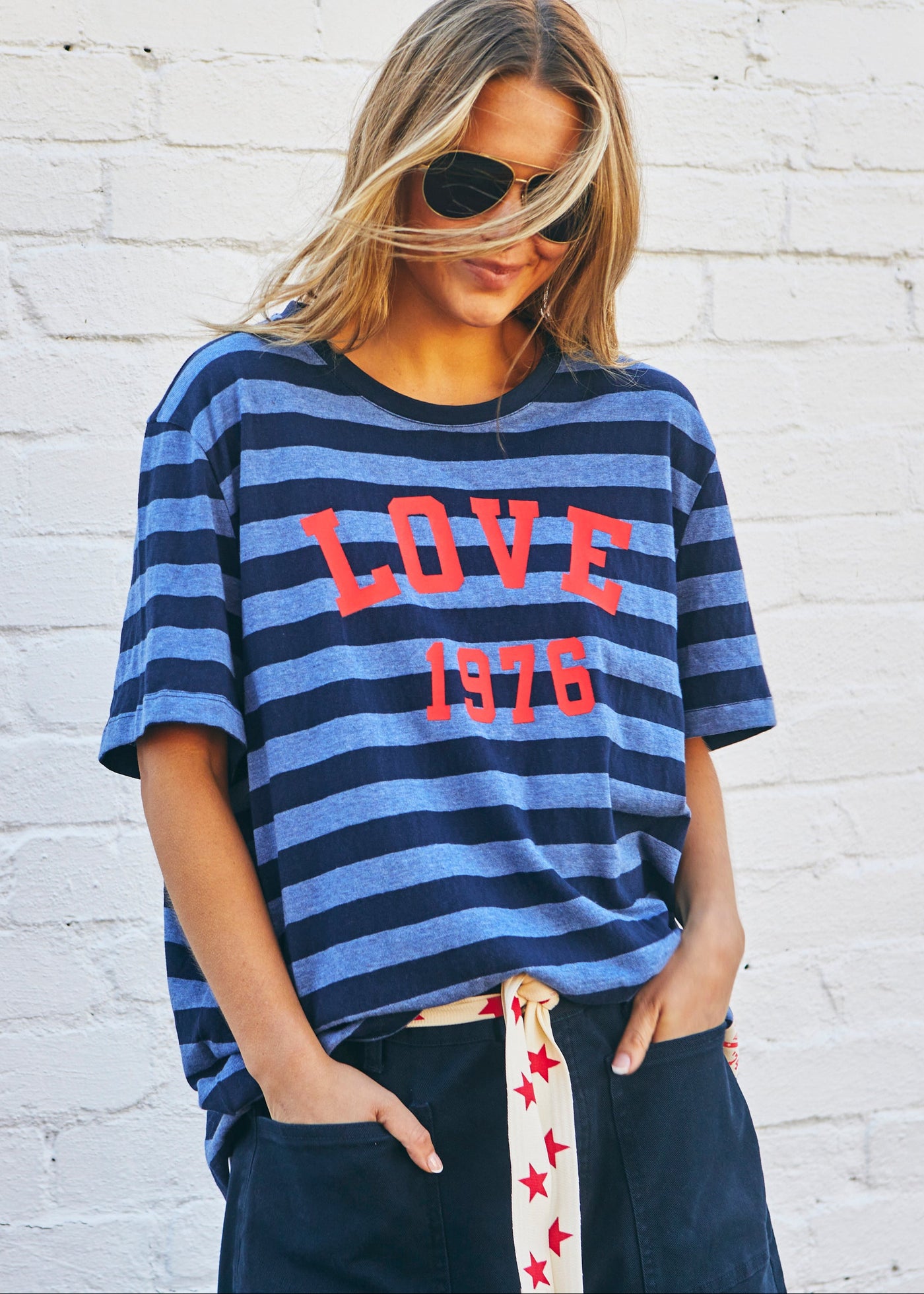 Hammill & Co bold navy and blue stripes and a pop of red“LOVE 1976” across the front.