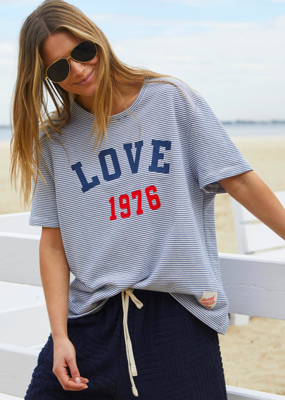 Hammill & Co tee is a total throwback in the best way. With fine navy and white stripes and a pop of red“1976 LOVE” across the front.