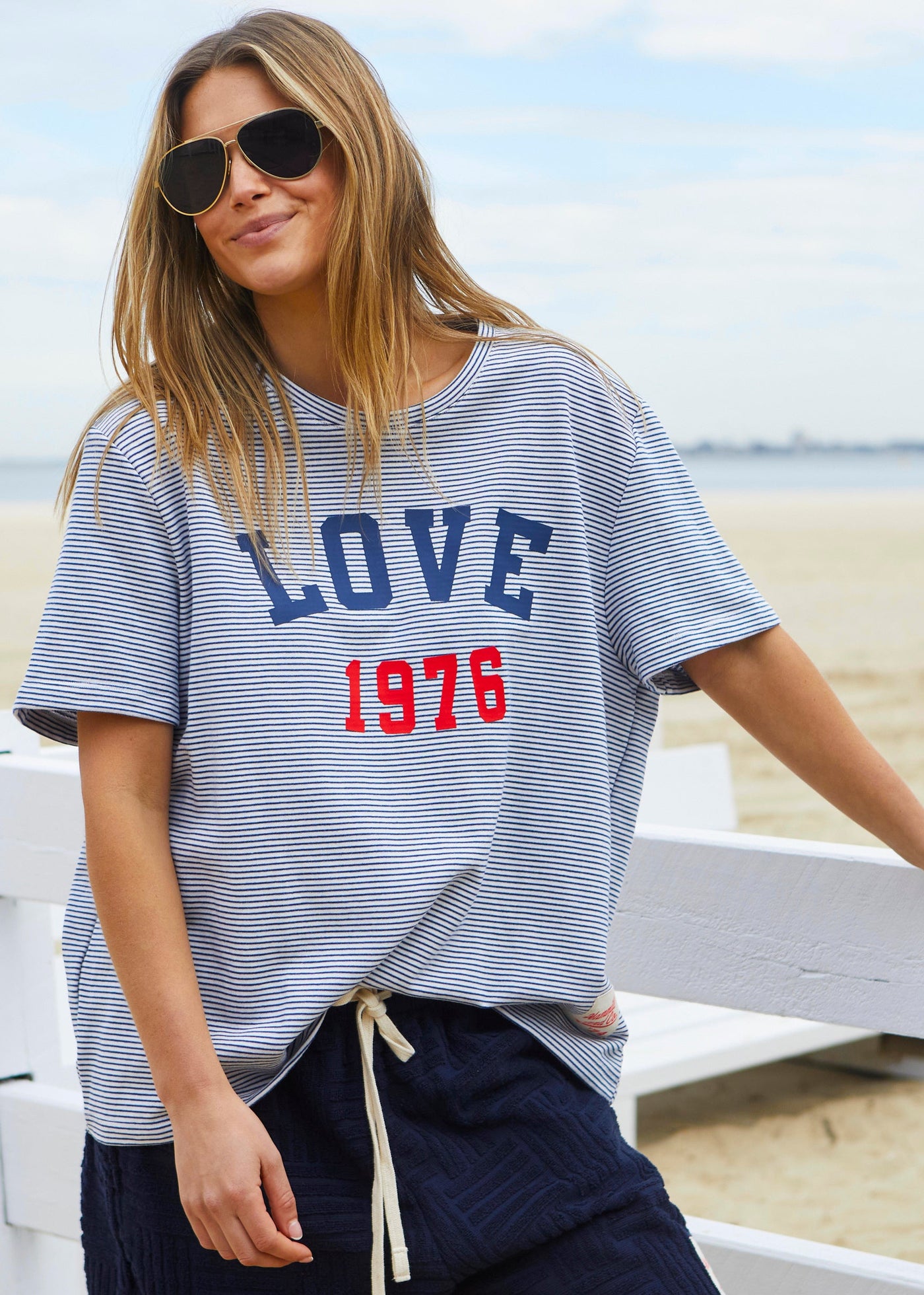 Hammill & Co tee is a total throwback in the best way. With fine navy and white stripes and a pop of red“1976 LOVE” across the front.