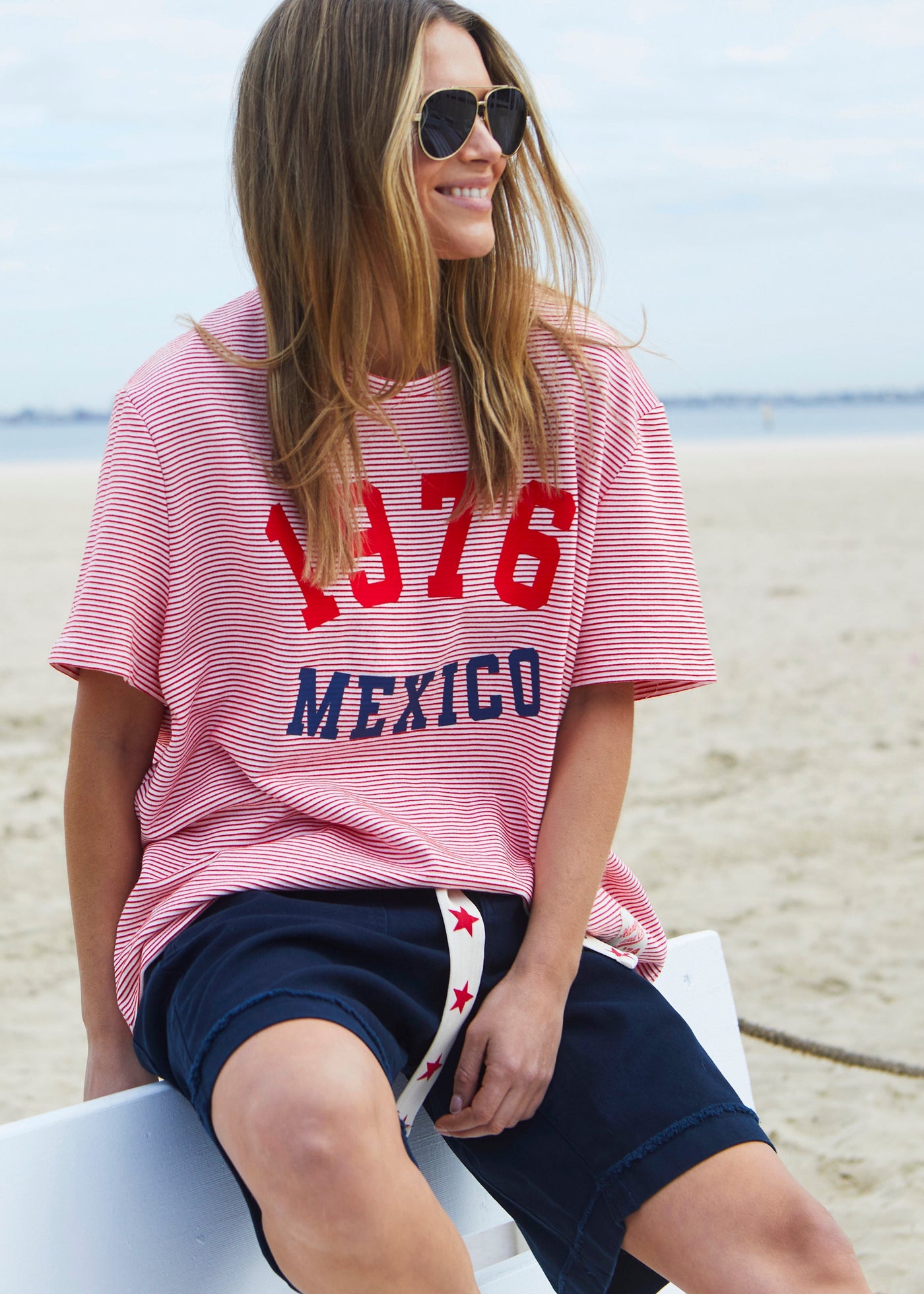 Hammill & Co tee is a total throwback in the best way. With fine red and white stripes and a pop of red and navy “1976 MEXICO” across the front.