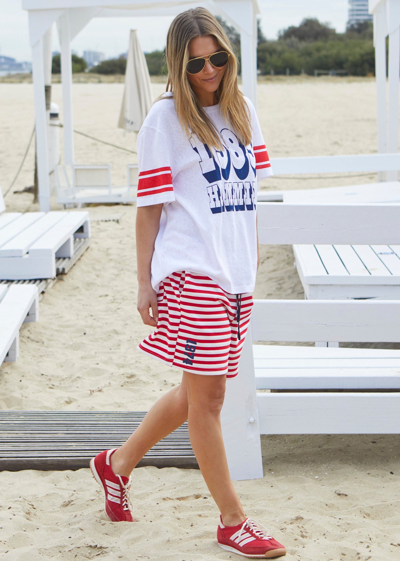 Hammill & Co White slouchy tee with navy 1985 print on the front and red stripes on each sleeve. Our standard over size fit, the same as our logo tees.