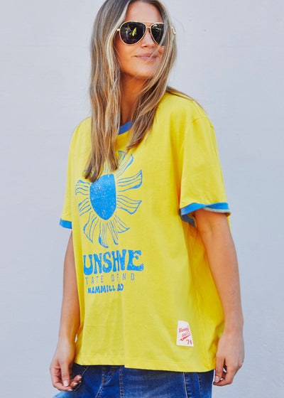Hammill & Co Sunshine State of Mind tee in a slouchy V neck style in a soft bright yellow slub jersey with royal blue print on the front .