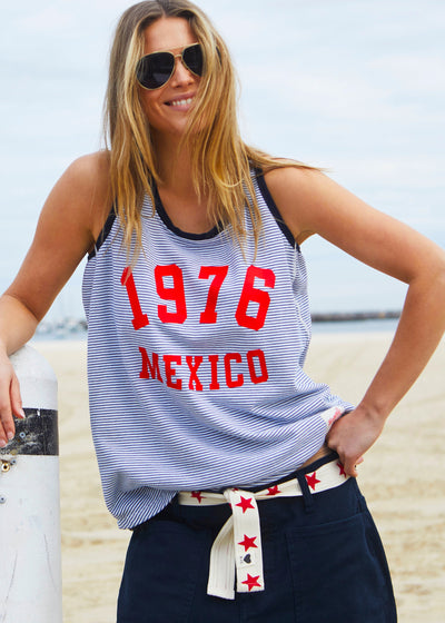 Hammill & Co Retro stripe tank in soft cotton navy and white fine stripe with navy rib. Red retro print 1976 MEXICO on the front.