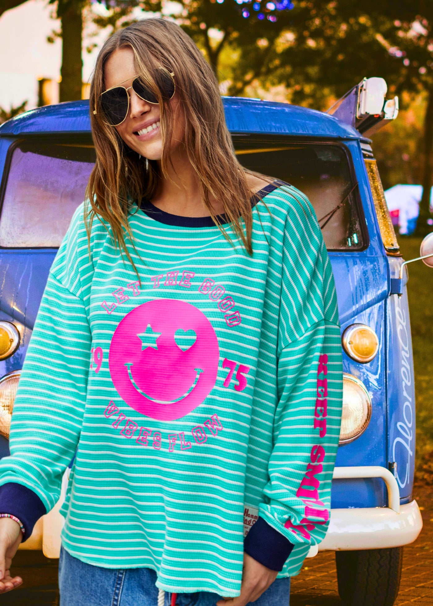 Hammill & Co Green and white stripe rib waffle long sleeve tee with navy contrast rib and pink Smily print on the front and keep smiling down the left sleeve. 