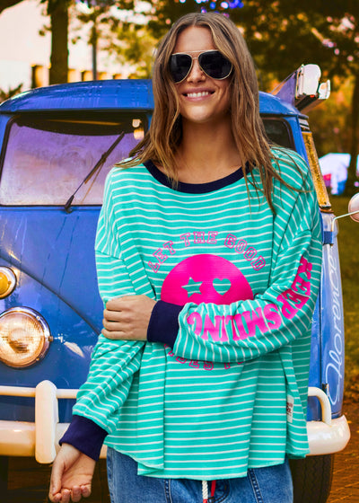 Hammill & Co Green and white stripe rib waffle long sleeve tee with navy contrast rib and pink Smily print on the front and keep smiling down the left sleeve. 