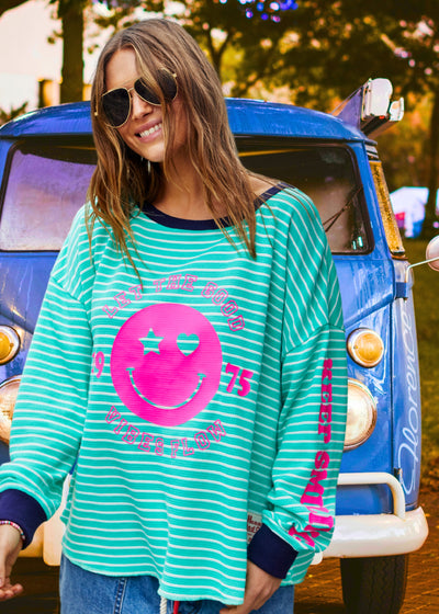 Hammill & Co Green and white stripe rib waffle long sleeve tee with navy contrast rib and pink Smily print on the front and keep smiling down the left sleeve. 