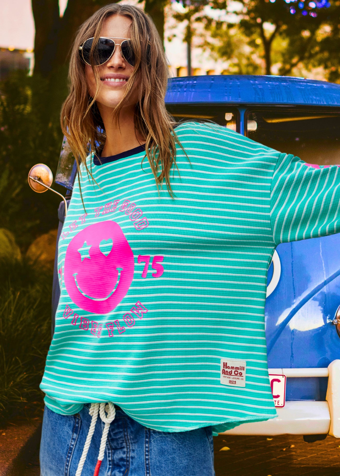 Hammill & Co Green and white stripe rib waffle long sleeve tee with navy contrast rib and pink Smily print on the front and keep smiling down the left sleeve. 