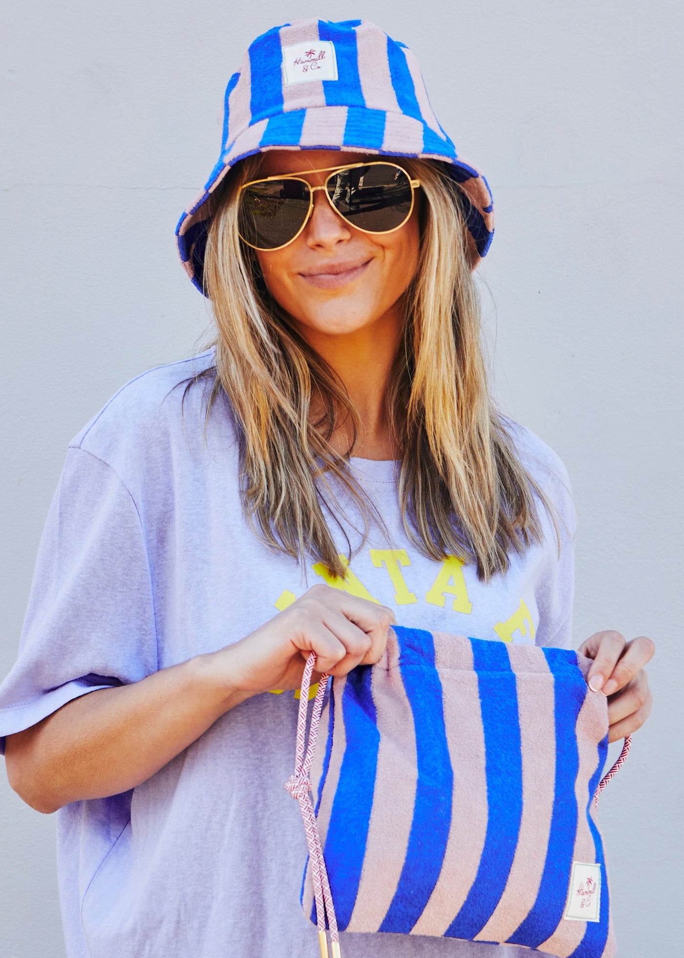 Hammill & Co bold striped bucket hat is pure summer happiness. Made from soft terry towelling in vibrant Royal and musk stripes.