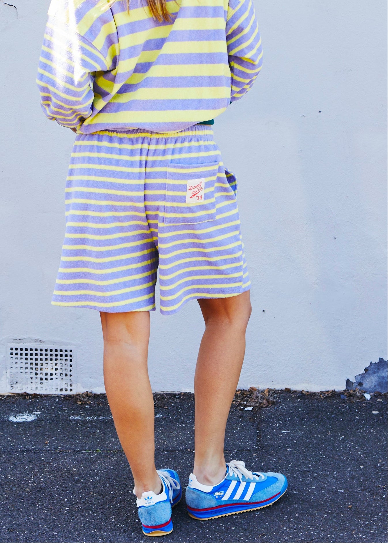 Hammill & Co relaxed terry towelling stripe shorts bring effortless summer energy with their playful lemon and mauve stripes.