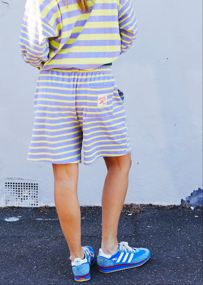 Hammill & Co relaxed terry towelling stripe shorts bring effortless summer energy with their playful lemon and mauve stripes.