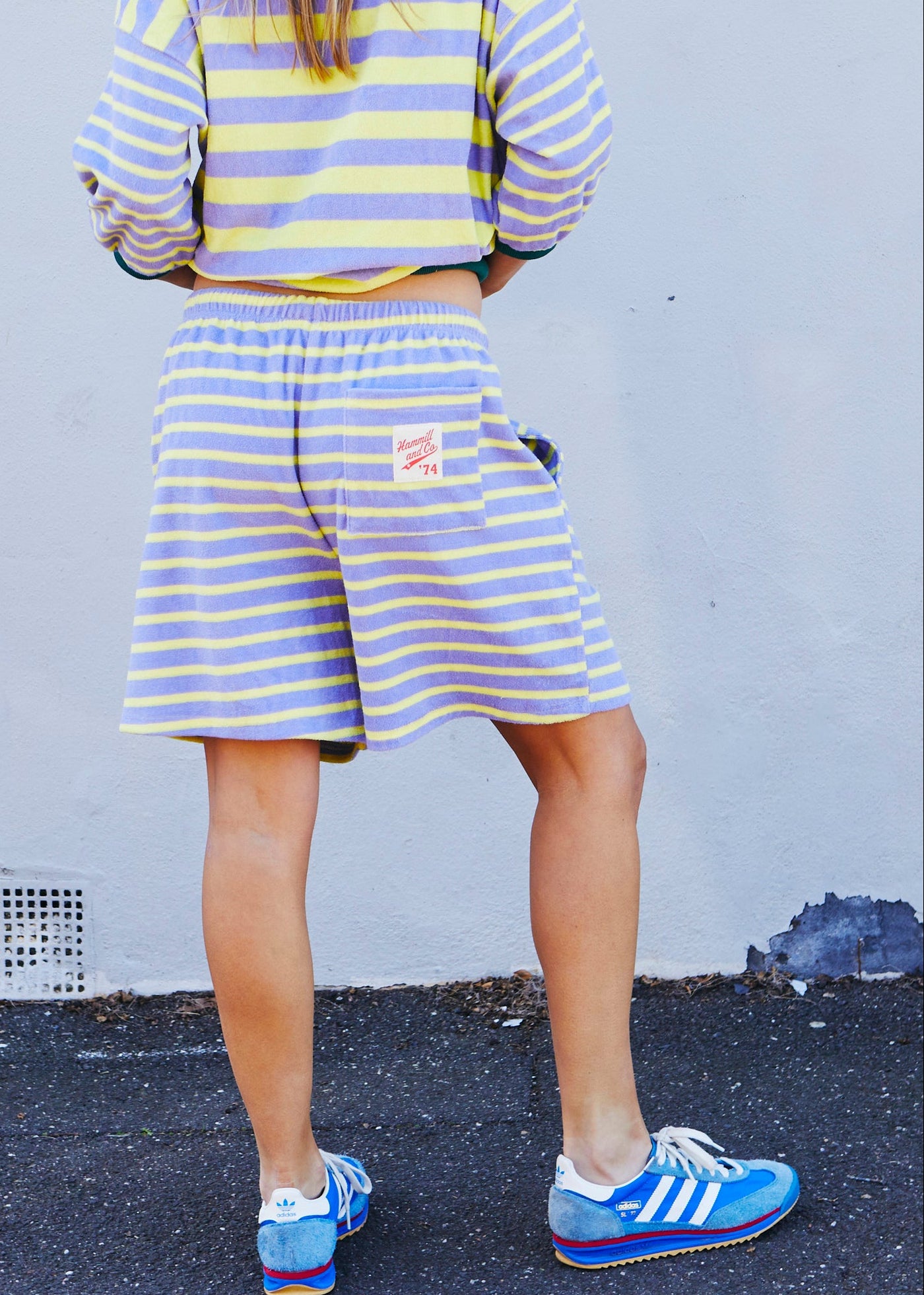 Hammill & Co relaxed terry towelling stripe shorts bring effortless summer energy with their playful lemon and mauve stripes.
