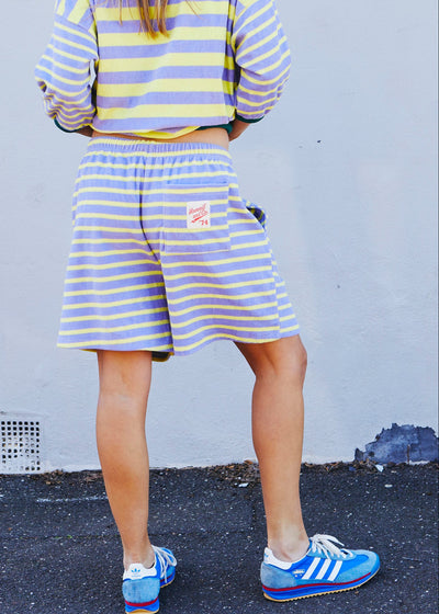 Hammill & Co relaxed terry towelling stripe shorts bring effortless summer energy with their playful lemon and mauve stripes.